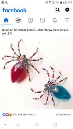 two spider figurines made out of beads and candy canes on a white surface