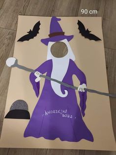 a paper cut out of a wizard holding a staff