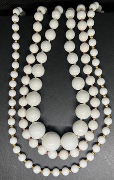 Vintage white colored necklace, vintage beaded necklaces, vintage necklace set, Monet necklace, vintage necklace, pre owned jewelry. Set of three white beaded necklaces. I believe they were made in the early 2000s. One branded by Monet. Two necklaces 24 inches long and the other 22 inches.   All jewelry purchases come beautifully gift wrapped at no additional cost. Complementary thank you goodie with each purchase as a token of our appreciation 1. Avoid Chemicals: Remove jewelry before using hou Vintage White Beaded Jewelry, White Beaded Pearl Necklace Costume Jewelry, White Round Beads Costume Jewelry Necklace, Handmade Vintage White Necklace, Vintage White Handmade Beaded Necklaces, White Round Bead Costume Jewelry Necklace, White Round Beaded Costume Jewelry Necklace, Vintage White Handmade Beaded Necklace, Handmade White Necklaces Vintage Collection