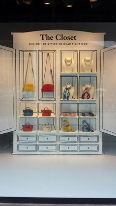 a display case filled with lots of purses