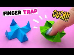 an origami finger trap is being held by someone's hand with the word finger trap on it