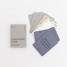 the conversation cards are laid out next to each other on a white surface with gray and blue tags