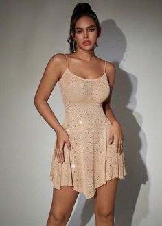 This Hot Drilling Mesh Cami Mini Dress is designed with a flared hem, adding a subtle touch of elegance to the sheer fabric. The beige color complements any skin tone, making it a versatile and stylish addition to your wardrobe. Perfect for a night out or special occasion. Fabric: High Stretch Material: Polyester, Elastane Glamorous Beige Summer Dress, Flirty Beige Party Mini Dress, Summer Party Dress With Flared Hem, Chic Party Dresses With Flared Hem, Cream Sheer Party Dress, Chic Neutral Mini Dress For Party, Flirty Beige Mini Dress For Night Out, Elegant Beige Sheer Mini Dress, Neutral Summer Party Dress