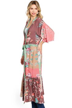 This stunning duster kimono features a classic longline silhouette with a ruffle panel along the bottom and a self tie belt at the waist. Soft floral mixed prints throughout. CARE | Hand Wash Cold or Dry Clean CONTENTS | 100% Viscose MEASUREMENTS | 48"/122 cm Top to Bottom (Size O/S) MODEL | 5'8 - wearing O/S IMPORTED Duster Kimono, Mixed Prints, Belt Tying, Soft Floral, Mixing Prints, Tie Belt, Long A Line, S Models, Blossom