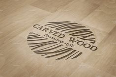 carved wood logo mockup on wooden flooring with the words carved wood in black