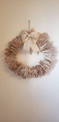 a wreath made out of books is hanging on the wall