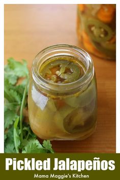 pickled jalapenos in a glass jar with cilantro on the side