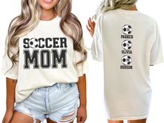 Celebrate your favorite soccer players with our custom soccer mom shirt, personalized with the players names and numbers on back. With short sleeves and a classic crewneck, this shirt makes the perfect gift for the soccer mom or mama who loves to show her support on game day at the soccer fields, making her feel like a varsity soccer super fan. COMFORT COLORS 1717 SHIRT: Unisex 100% US cotton - ethically grown and harvested Pre-Shrunk Fabric Relaxed Fit - Size up for a trendy oversized look Seam Personalized White Sporty T-shirt, Personalized Crew Neck T-shirt For Fans, Personalized Fan Merchandise Crew Neck T-shirt, Personalized Sporty T-shirt For Sports, Sporty Personalized T-shirt For Sports, Personalized Crew Neck Sports Top, Personalized Crew Neck Tops For Fan Merchandise, Personalized Sporty Tops For Sports, Sporty Personalized Tops For Sports Events