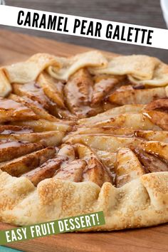 a close up of a pie on a table with the words caramel pear galette