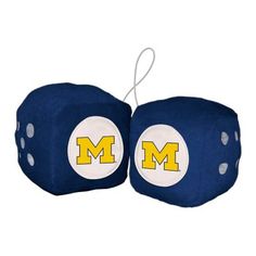 two blue and white dices with michigan m on the front one has yellow letters