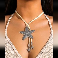 Bohemian Starfish Lariat Style Necklace Has A Cream Colored Faux Leather Cord With Starfish Beads Big Starfish Measures 2.5" Across Total Length Of Cord & Charm Is 24" Tags: Ocean Beach Summer Vacation Coastal Oceanic Boho Bohemian N#200 Metal Starfish Jewelry, Silver Starfish Charm Necklace For Summer, Silver Starfish Charm Jewelry For Summer, Bohemian Silver Jewelry With Starfish Charm, Silver Necklace With Starfish Charm For Summer, Silver Jewelry With Starfish Charm For Summer, Beach-ready Adjustable Silver Jewelry, Adjustable Star Charm Necklace For Summer, Adjustable Silver Starfish Necklace