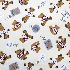 a white fabric with brown teddy bears on it