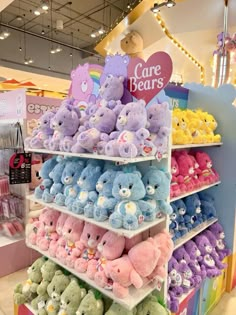 there are many stuffed animals on display in the store