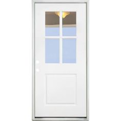 a white door with a glass paneled in to the side and light fixture on top