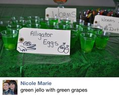 green jello glasses with name tags on them sitting on a table next to each other