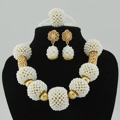 Make your wedding day truly memorable with our custom-made bridal jewelry set. White Jewelry Sets For Wedding, Handmade Bridal Necklace For Wedding, Handmade Round Bridal Necklace For Wedding, Traditional White Jewelry For Marriage, Elegant Handmade Necklaces For Marriage, Elegant White Jewelry Sets For Brides, Elegant White Necklace For Bride, Elegant White Bride Necklaces, Gold Beaded Bridal Set For Wedding