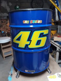 a large blue barrel with the number 46 on it