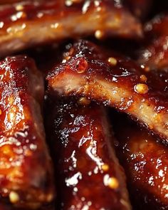 closeup of barbecue ribs covered in bbq sauce