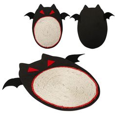 two black and white cat shaped rugs with bats on the top, one in red