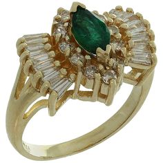 This elegant ring is crafted in 14k yellow gold and set with a gorgeous deep green sparkling marquise-cut emerald, accented with round brilliant-cut and baguette-cut diamonds of an estimated 1.36 carats. The emerald weighs an estimated 0.70 carats and has some light imperfections. Made in United States circa 1980s. Measurements: 0.55" (14mm) width. The ring size is 6.25 - EU 53. Resizable. Sizing fees will be provided upon request. Diamond Gold Ring, Rings Luxury, Baguette Cut Diamond, Diamond Gold, Elegant Ring, Gold Diamond Rings, Marquise Cut, Emerald Diamond, Deep Green