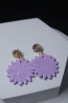 Blooming with style, these Blossom Earrings are the perfect accessory for any occasion. The delicate floral design, accented with a touch of gold, adds a subtle touch of elegance to any outfit. Perfect for work or everyday wear, these earrings will enhance your spring wardrobe with a fresh and feminine flair. Lavender Drop Flower Earrings, Purple Flower Shaped Jewelry For Spring, Lavender Flower Jewelry For Pierced Ears, Feminine Earrings For Spring Formal Occasions, Spring Flower-shaped Formal Earrings, Trendy Purple Flower Jewelry, Trendy Lavender Earrings For Gift, Touch Of Gold, Spring Wardrobe