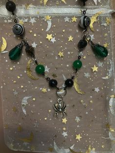 A Halloween inspired green and black spider necklace. Made with 20 gauge black wire, jump rings, plastic beads, glass beads, lobster claw clasp, and a spider charm. 🕷️ Warwick Ny, Spider Necklace, Black Spider, Doll Jewelry, Handmade Wire Jewelry, Handmade Wire, Plastic Beads, Jewelry Inspo, Green And Black