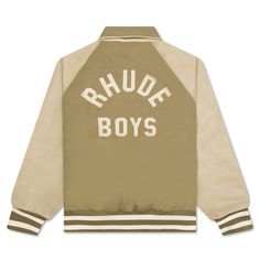 The Rhude Twill Rhude Boys Bomber makes a statement in any apparel rotation. Composed of cotton, the silhouette features leather detailing in addition to two side pockets and a zip closure. The applique branding at the rear paired with the striped rib-knit trims finishes the look. Cotton blend Full-zip closure Leather detailing Side pockets Applique branding Striped rib-knit trims Style No: RHPS23JA068292690269 Sporty Cotton Khaki Outerwear, Sporty Khaki Cotton Outerwear, Classic Cotton Outerwear With Embroidered Logo, Beige Cotton Outerwear With Zipper Closure, Trim Styles, Leather Detailing, Shipping Labels, Back Shoulder, Shoulder Sleeve