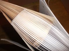 an open book sitting on top of a wooden table