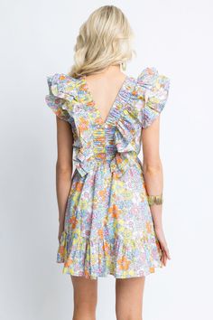 The Floral London Double Vneck Dress features a unique floral London print, complemented by a flattering v-neckline and feminine ruffle details. The fun and easy style makes this dress perfect for any occasion. Ditsy Floral Print V-neck Dress For Garden Party, V-neck Printed Floral Dress For Garden Party, V-neck Ruffled Sundress Mini Dress, Summer V-neck Dress With Ditsy Floral Print, V-neck Mini Dress With Ditsy Floral Print For Vacation, V-neck Floral Dress With Ditsy Print, Summer Tiered V-neck Dress With Ruffles, V-neck Ruffle Hem Sundress, V-neck Dress With Smocked Back For Brunch