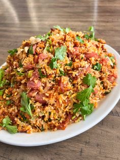 a white plate topped with rice and vegetables