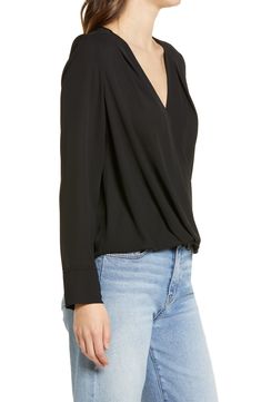 Move easily from desk to dinner in this polished shirttail blouse detailed with a lightly draped crossed front. 21" regular front length; 26" back length (size Medium); 19" petite front length; 25" back length (size Medium P)   Surplice V-neck   Long sleeves   65% polyester, 35% recycled polyester   Machine wash, dry flat   Imported   Women's Clothing Elegant Long Sleeve Wrap Top For Work, Versatile Surplice Neckline Blouse For Fall, Versatile Fall Blouse With Surplice Neckline, Elegant Wrap Top For Workwear In Fall, Elegant Faux Wrap Top For Workwear, Elegant Wrap Top For Workwear, Elegant Wrap Top For Fall Workwear, Elegant Wrap Top For Work, Elegant Fall Wrap Top For Work