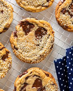 chocolate chip cookies on a cooling rack with blue polka dot napkins and white dots