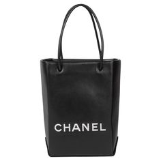 CHANEL Black & White Lambskin Mini Shopping Bag Tote Serial Number: 12792574 Age (Circa): 2008 Accompanied By: Chanel Dust Bag, Authenticity Card, Care Booklet Authenticity Details: Authenticity Card, Serial Sticker (Made in Italy) Gender: Ladies Type: Tote, Shopper Colour: Black, White Hardware: Silver Material(s): Lambskin Leather Interior: Patterned Textile Closure: Open Top Height: 21cm Width: 14cm Depth: 8cm Handle Drop: 11cm -The exterior is in excellent condition with minimal signs of use Mini Shopping Bag, Chanel Black And White, White Hardware, Chanel Mini, Handbags Online, Chanel Black, How To Make Notes, Textile Patterns, Leather Interior