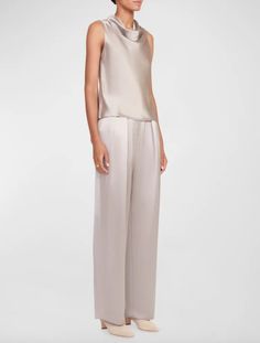 Our signature pant updated in a satin fabric with a silver lamé finish. the luisa is a wide leg pleated trouser with hook and zip closure.  - s: 70% silk 30% metallic plain    - model is 5'10" and wearing a size 2    - dry clean only Sleek Silk Wide Leg Pants, Chic Spring Bottoms With Sheen, Chic Sheen Bottoms For Spring, Chic Spring Sheen Bottoms, Elegant Sheen Bottoms For Party, Elegant Party Bottoms With Sheen, Chic Pants With Sheen For Night Out, Chic Sheen Pants For Night Out, Elegant Silk Wide Leg Pants For Summer