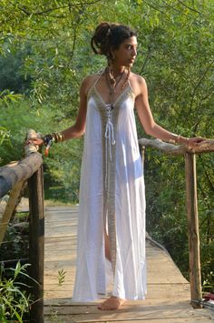 Boho maxi dressOur elegant, flowing Boho Infinity dress is in white withe gold aplique  back in stock finally A Gypsy dress with style and sophistication. Made from Rayon (a wood based fabric) with stunning intricate natural hemp applique. This is definitely a Hippie dress with style. It is for DRY CLEAN only .My love for Alternative clothing in a kind of Hippie clothes style is obvious here , fusing Bohemian with class. This Loose maxi dress is ideal for evening out and looking stunning at part Promenade Dress, Pagan Clothing, Dress Alternative, Maxi Dress Designs, Pixie Dress, Hippie Dress, Hippie Clothes, Loose Maxi Dress, Bohemian Maxi Dress