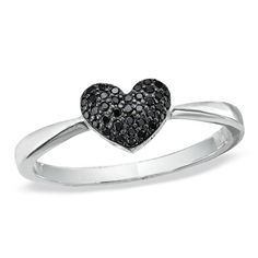 a white gold ring with black diamonds in the shape of a heart