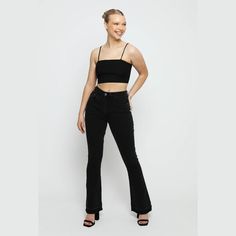 "Make a statement in our high waisted frayed flare jeans. The black wash and stretchable denim fabric give you a unique look that is sure to turn heads. The soft denim fabric and adjustable waist ensure a comfortable fit all day long. So go ahead and pair these black wash high waisted frayed flare jeans with cute crop tops and rock street style with confidence! Few amazing attributes: Black wash stretch Denim fabric Frayed hem High waisted Flare style Button and zip fly fastening Belt loops 5-pocket design Internal waist adjusters as product image Fabric: 98% Cotton, 2% Elastane Note: This Model is 5'9\" and Wears Size 8, To find the perfect fit for yourself check our Size Guide. Model is 5'9\" and Wears Size 8 FIND YOUR SIZE and check our size guide to find your perfect fit. Size = 6 - 18 Rock Street Style, Frayed Flare Jeans, Womens Flare Jeans, Denim Essentials, High Waisted Flare Jeans, Stretch Denim Fabric, Leggings Hoodie, High Waisted Flares, Cute Crop Tops