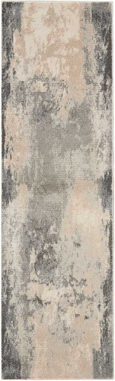 an area rug with grey and beige colors