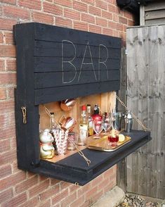 an outdoor bar with drinks on it