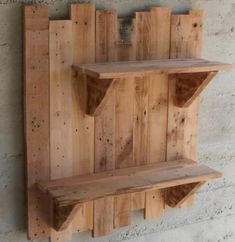 two wooden shelves are mounted on the wall