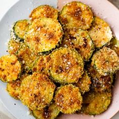 zucchini fritters on a plate with parmesan cheese