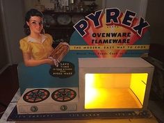 an oven that is lit up with the light on it's front and side