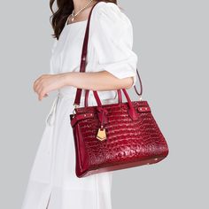 The handbag that all your friends will envy you for. Made with mesmerizing crocodile leather look and tasteful golden details, the Malin-Tassou Chic Urban Handbag exudes charm and confidence like no other. Buy all 4 colors and save $80!Product Information Material: Leather Lining Material: Polyester Zipper Closure Top Handle & Long Shoulder Jewlery Necklace, Dress Pant Suit, Womens Dress Suits, Blouse Pants, Crocodile Leather, Crossbody Tote, Sweater Pants, Mens Activewear, Black Handbags