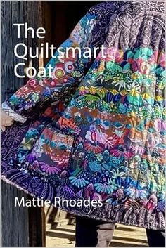 a woman wearing a multicolored jacket with the words, the quiltmarr coat