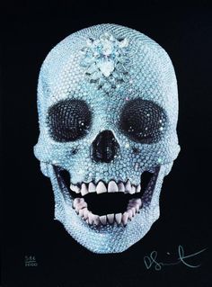 a white skull with lots of diamonds on it's face