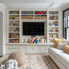 a living room filled with lots of furniture and bookshelves covered in stuffed animals