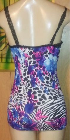 Leopard multi colored print cami top with beautiful delicate black lace straps and lace on the top front and top back. Pair it up with a pair of purple shorts or black. Material: 100% rayon Multicolor Floral Print Camisole With Spaghetti Straps, Multicolor Floral Print Spaghetti Strap Camisole, Purple Camisole With Built-in Bra, Purple Camisole With Built-in Bra And Spaghetti Straps, Fitted Multicolor Camisole, Multicolor Adjustable Straps Camisole, Multicolor Adjustable Strap Camisole, Leopard Print Cami, Fix Clothing