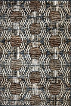 a brown and white rug with an abstract design