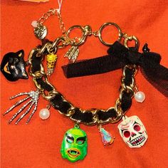 Brand New Betsy Johnson Glow In The Dark Charm Bracelet With Rhinestones And Black Ribbon Going Through The Gold Bracelet Charms Include Skeleton Hand, Cat, Skull Candy, Corn, Monster Of The Lagoon Neon Carnival, Halloween Glow In The Dark, Glowing In The Dark, Junk Jewelry, Cat Skull, Skeleton Hand, Bracelet Charms, Skeleton Hands, Betsey Johnson Jewelry