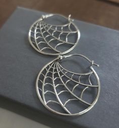 sterling silver spiderweb hoop earrings 26x26 Endless possibilies with these spider web earrings, decorate with dark gemstones to add sparkle. wire wrap with tiny gems. perfect for halloween jewelry collection. Dark Gemstones, Spider Web Earrings, Dragonfly Jewelry, Earrings Halloween, Pretty Clothes, Halloween Jewelry, Birthstone Charms, Wire Wrap, Spider Web